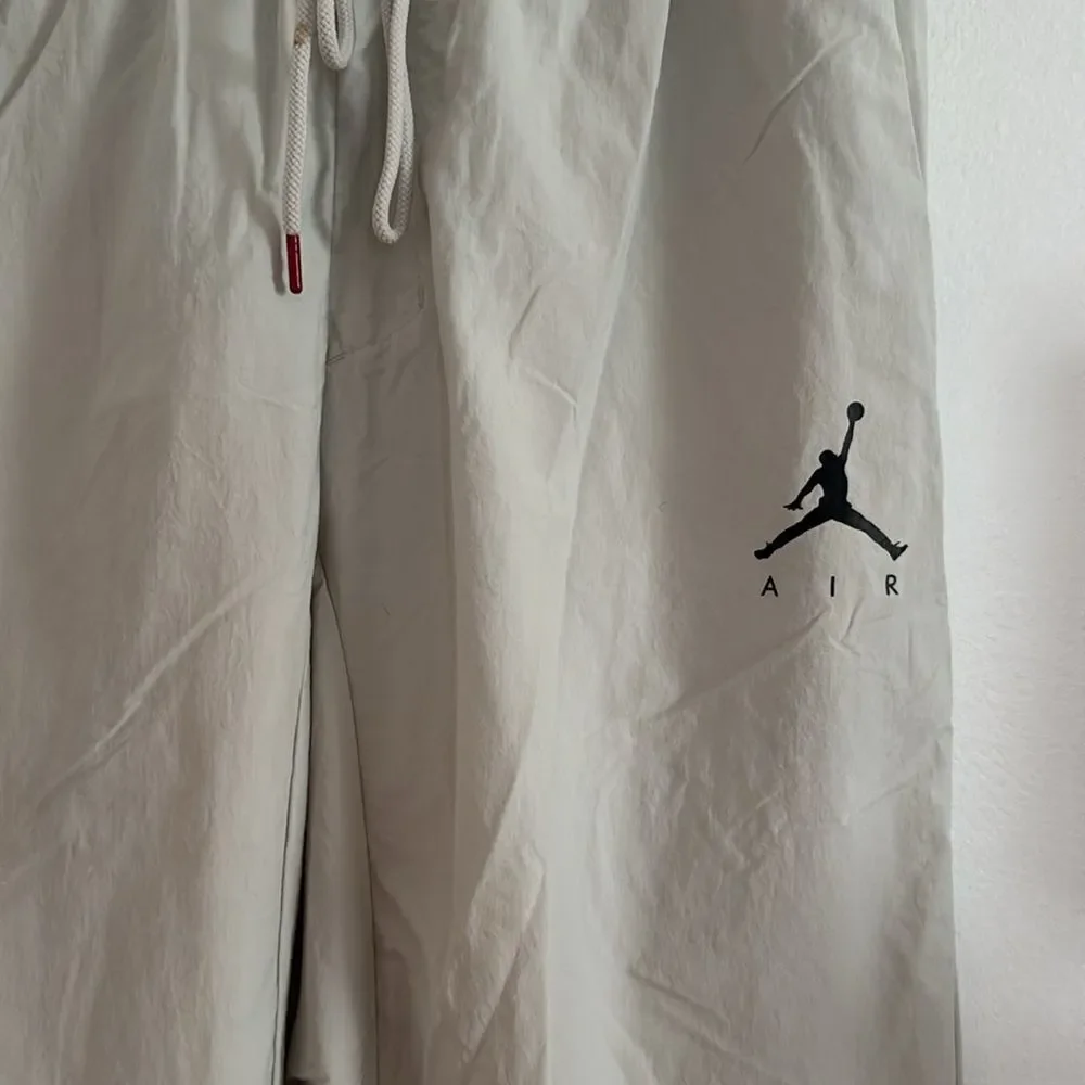 Jordan Cream Sweatpants with Jumpman Logo and Elastic Waistband